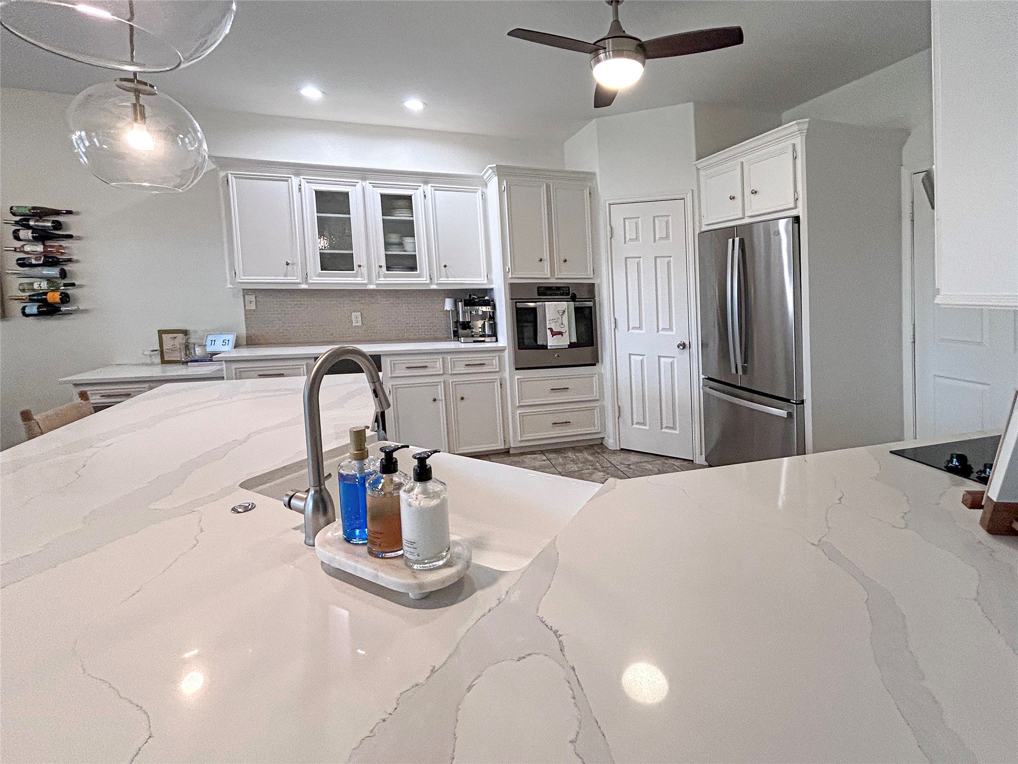 626 Sunset Trail Angleton, TX 77515 - Photo 16 of 43 a kitchen with refrigerator a microwave and stove