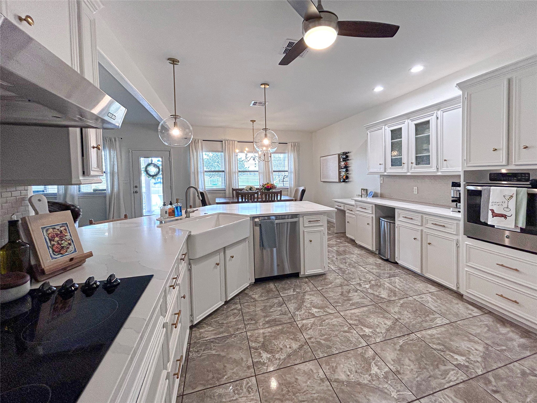 626 Sunset Trail Angleton, TX 77515 - Photo 17 of 43 a kitchen with a sink window and cabinets