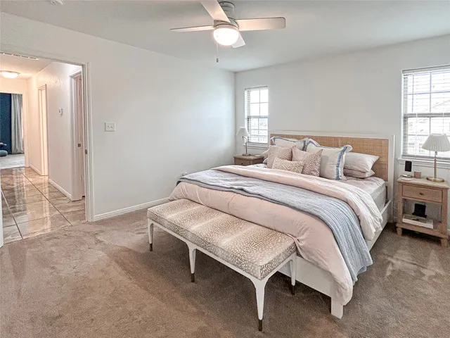 a bed room with a bed and a window