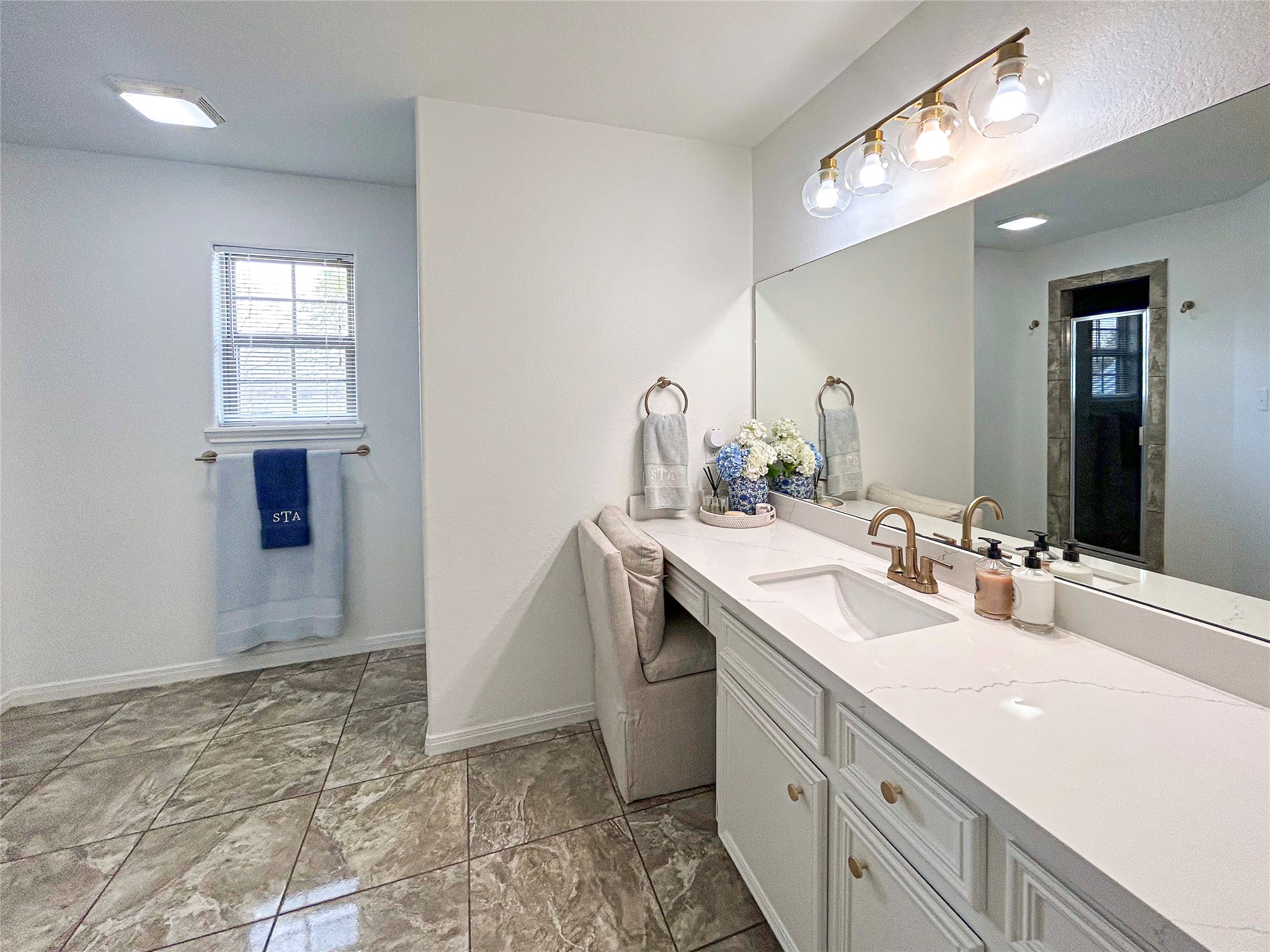 626 Sunset Trail Angleton, TX 77515 - Photo 23 of 43 a bathroom with a sink a vanity and a mirror