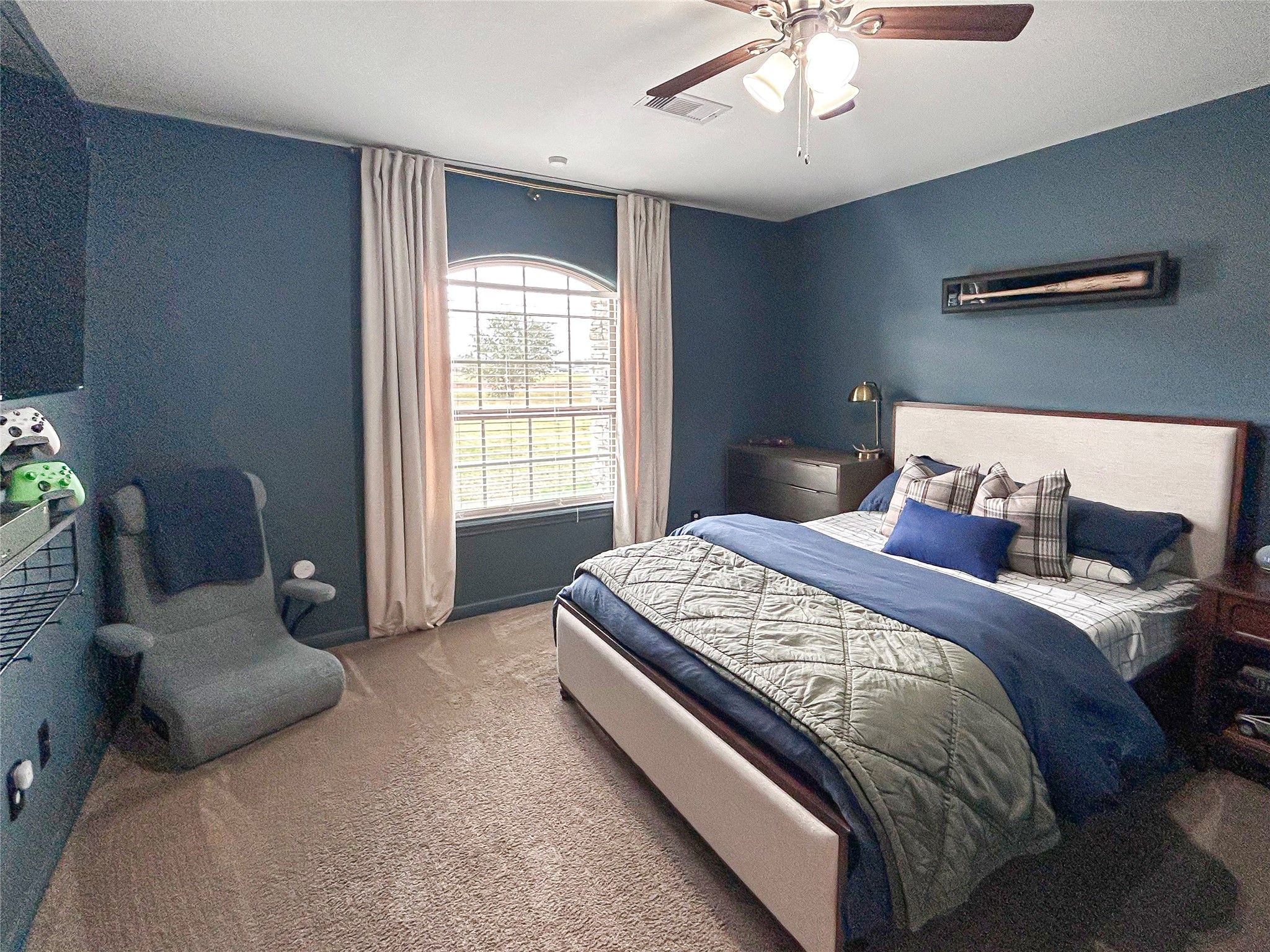 626 Sunset Trail Angleton, TX 77515 - Photo 26 of 43 a bedroom with a bed and a chandelier