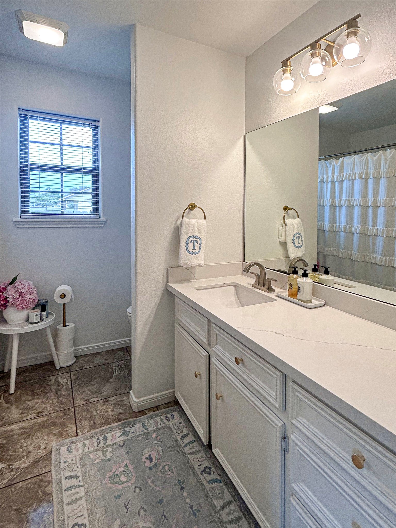 626 Sunset Trail Angleton, TX 77515 - Photo 27 of 43 a bathroom with a sink and a mirror