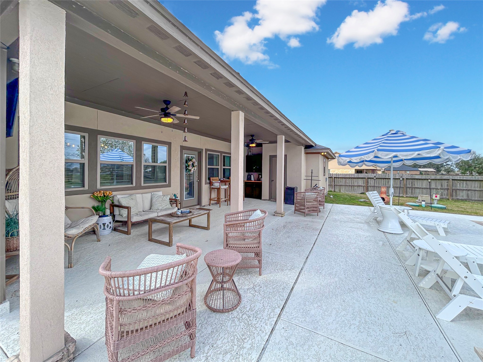 626 Sunset Trail Angleton, TX 77515 - Photo 31 of 43 a view of a patio with couches table and chairs and potted plants