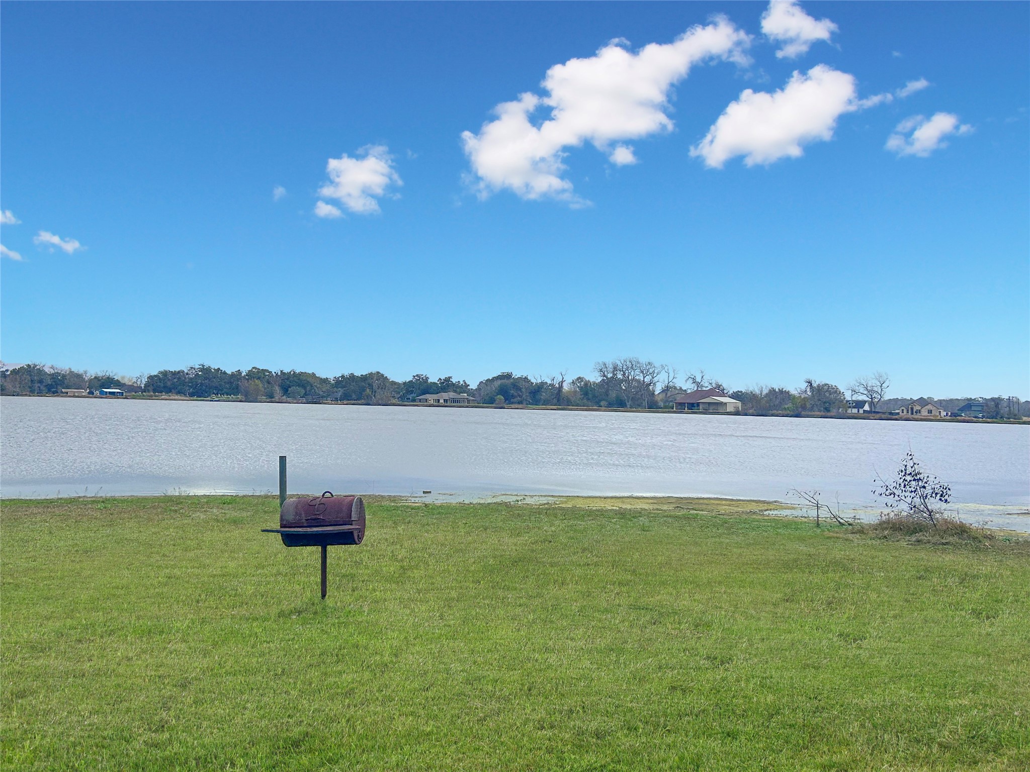 626 Sunset Trail Angleton, TX 77515 - Photo 41 of 43 a view of lake with table and chairs