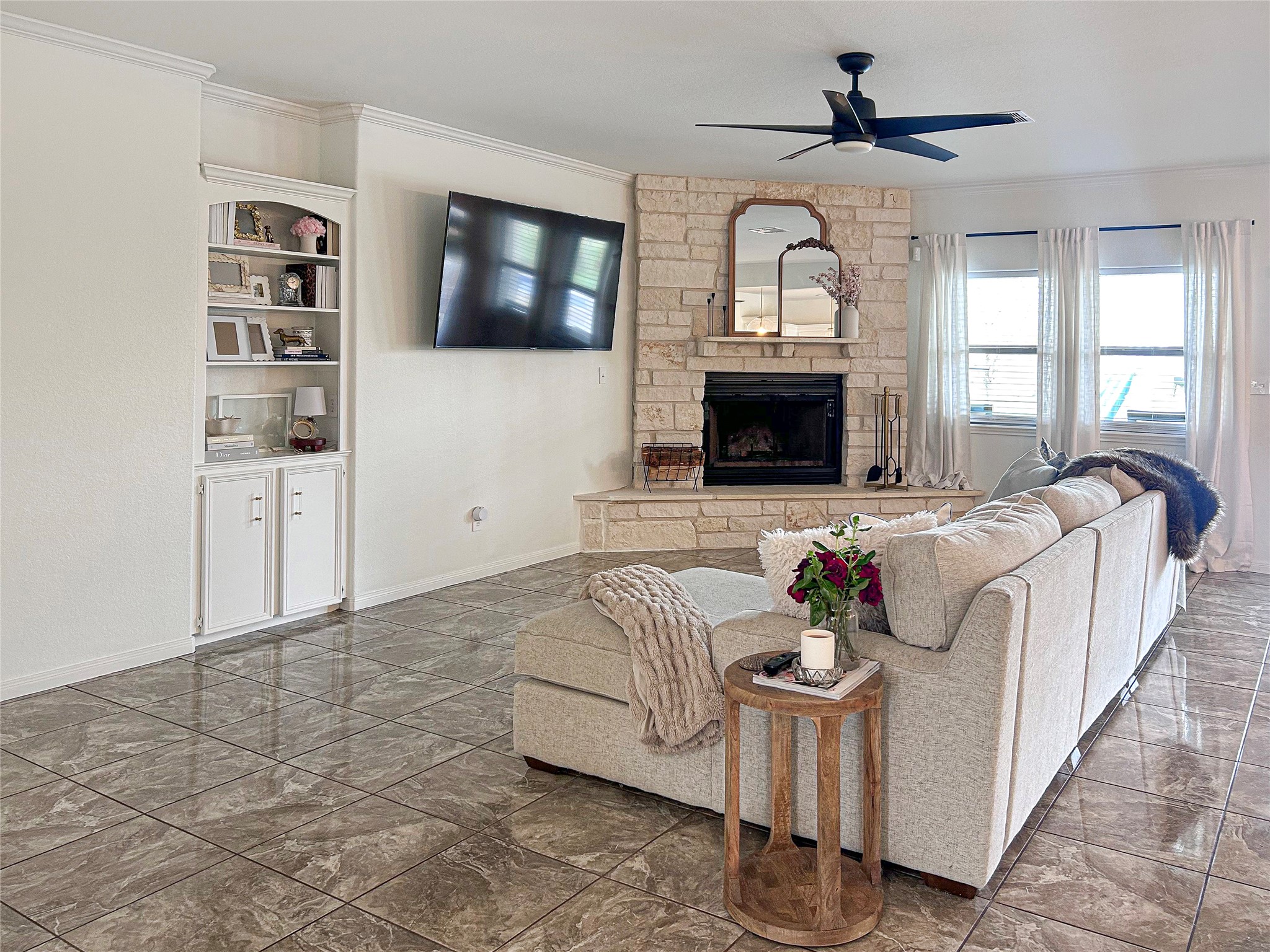 626 Sunset Trail Angleton, TX 77515 - Photo 10 of 43 a living room with furniture a fireplace and a flat screen tv