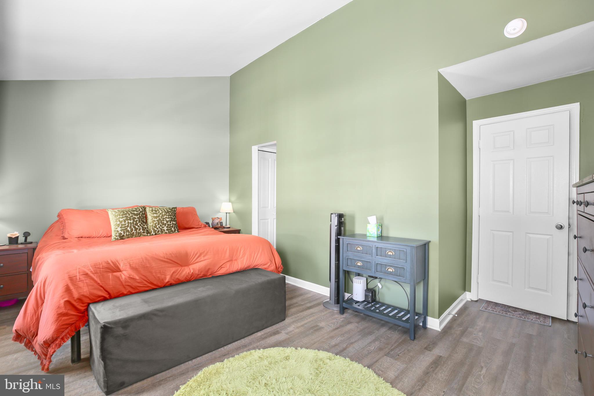 12385 Manchester Way Woodbridge, VA 22192 - Photo 14 of 32 a bedroom with a bed and wooden floor