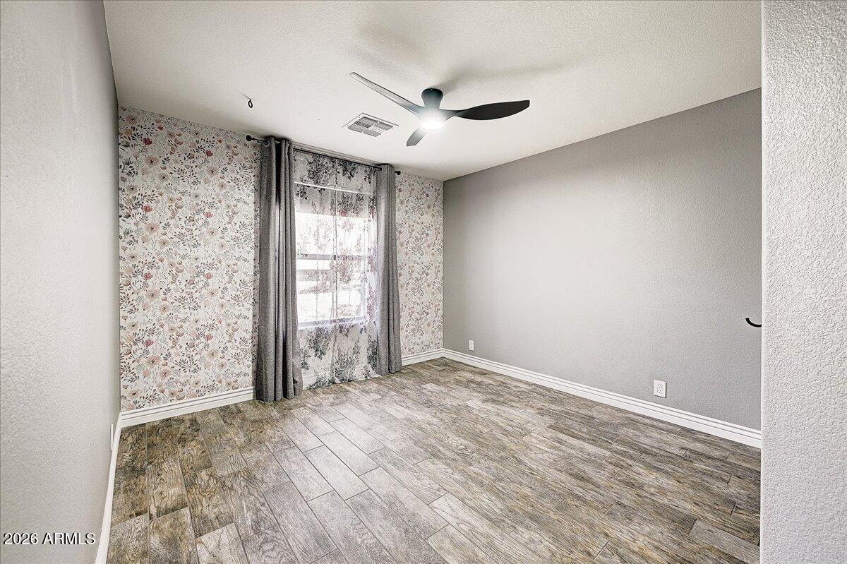 7624 North Citrus Road Waddell, AZ 85355 - Photo 33 of 57 a view of an empty room with a window