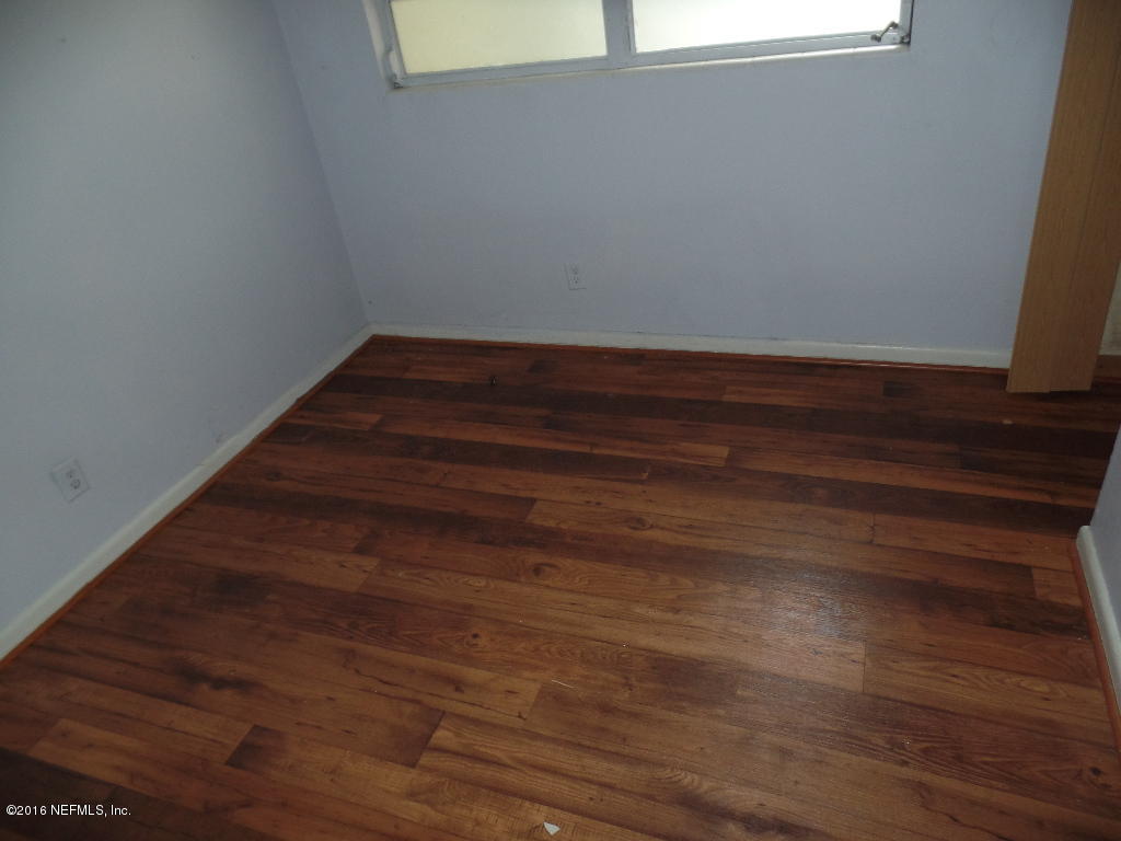4749 Andromeda Road Jacksonville, FL 32210 - Photo 8 of 12 a view of small space with wooden floor