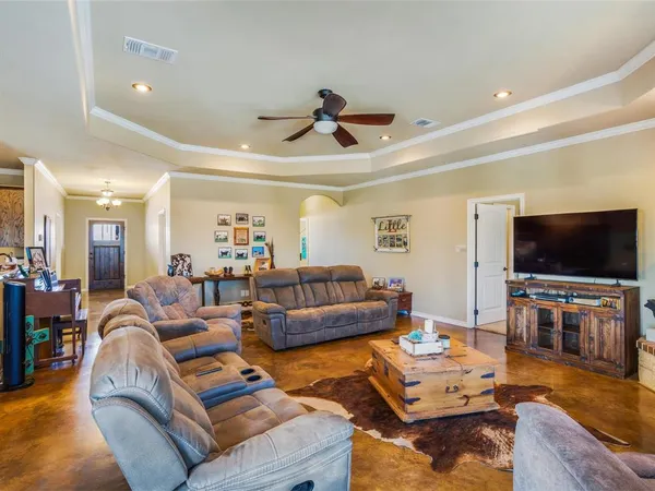 a living room with furniture and a flat screen tv