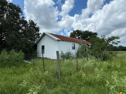 a view of backyard with garden and entertaining space