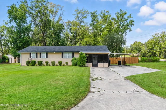 front view of a house with a yard