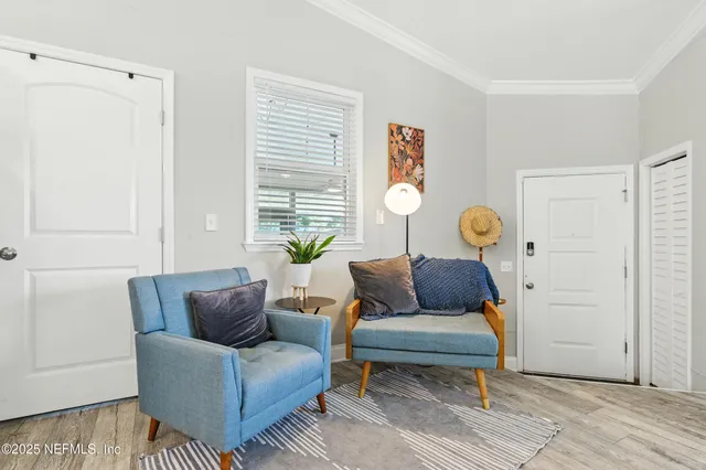 a living room with furniture and a window