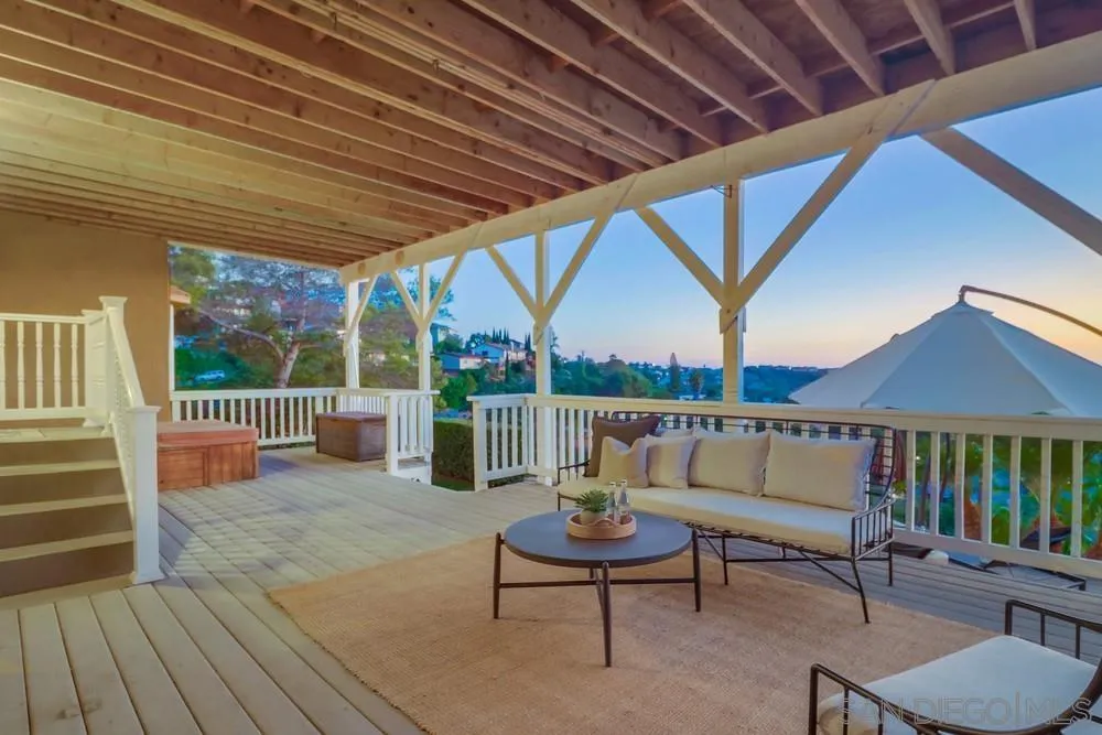 7970 Pasadena Avenue La Mesa, CA 91941 - Photo 11 of 38 a balcony with furniture and a wooden floor