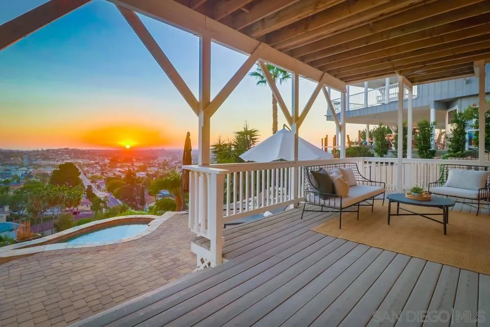 7970 Pasadena Avenue La Mesa, CA 91941 - Photo 13 of 38 a view of roof deck with wooden floor and outdoor seating