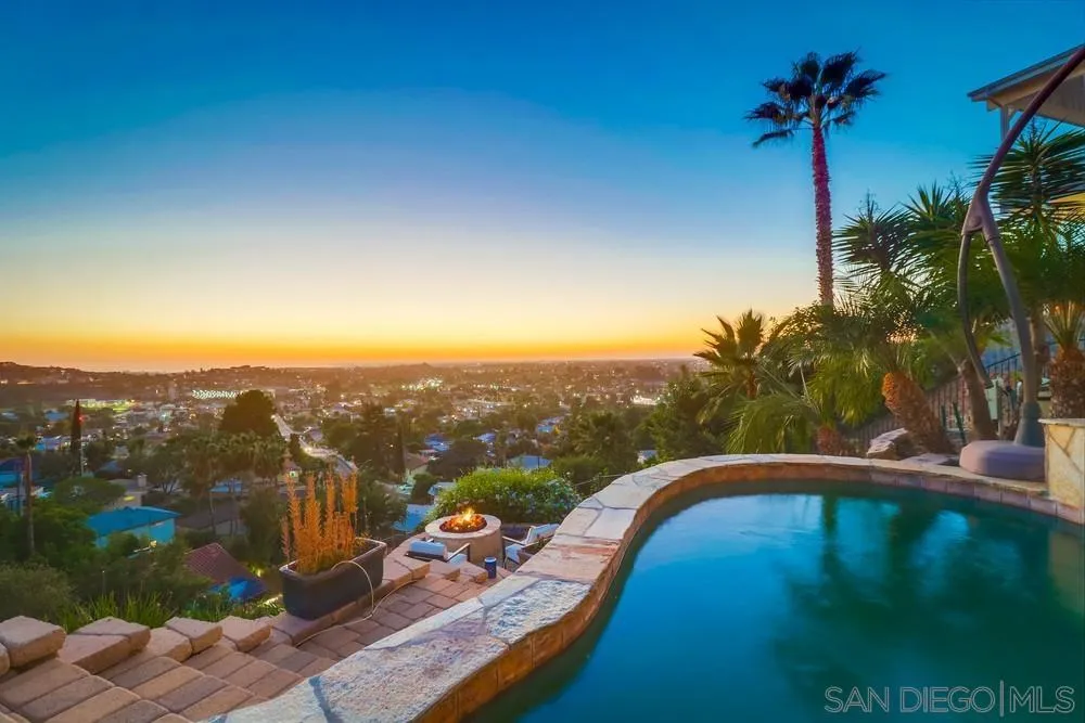 7970 Pasadena Avenue La Mesa, CA 91941 - Photo 18 of 38 a view of a swimming pool with a yard