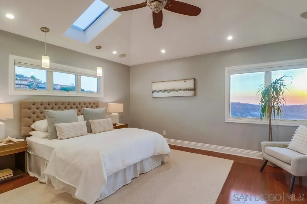 7970 Pasadena Avenue La Mesa, CA 91941 - Photo 19 of 38 a bedroom with double bed and a couch