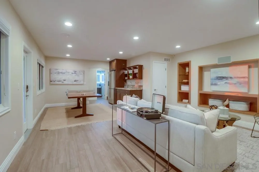 7970 Pasadena Avenue La Mesa, CA 91941 - Photo 22 of 38 a living room with furniture and a flat screen tv