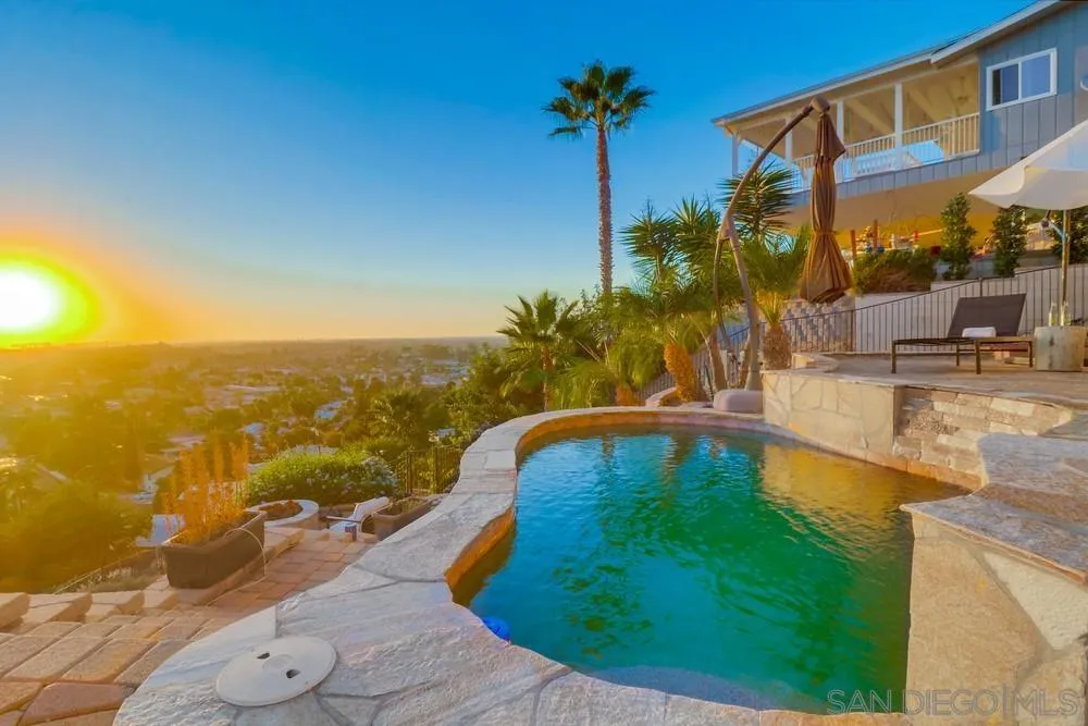 7970 Pasadena Avenue La Mesa, CA 91941 - Photo 33 of 38 a swimming pool with outdoor seating and yard