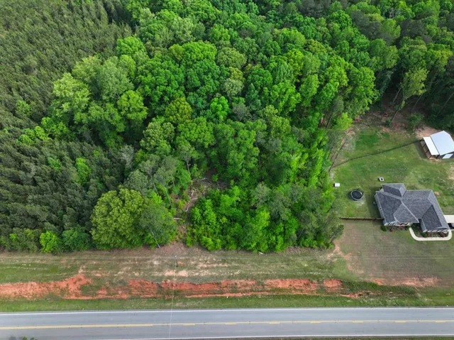 a view of a swimming pool with an outdoor space and seating area