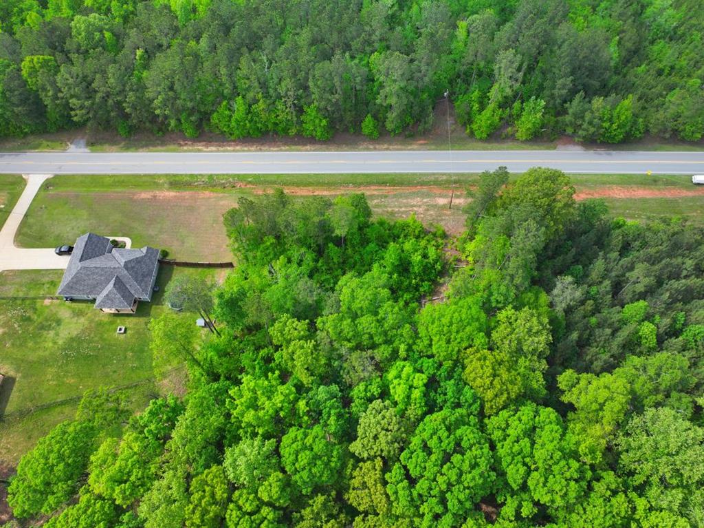 0 Ga Highway Waverly Hall, GA 31831 - Photo 5 of 5 a view of a swimming pool with an outdoor space and seating area