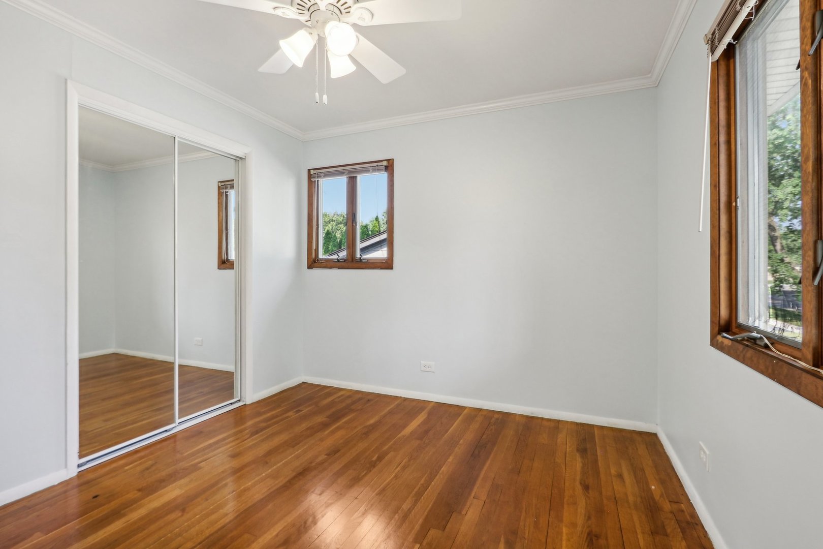 2405 Martin Lane Rolling Meadows, IL 60008 - Photo 12 of 22 a view of empty room with wooden floor and fan