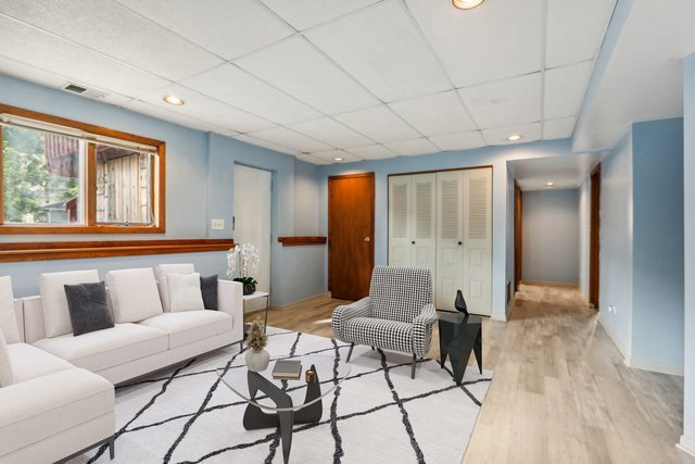 2405 Martin Lane Rolling Meadows, IL 60008 - Photo 15 of 22 a living room with furniture and a window