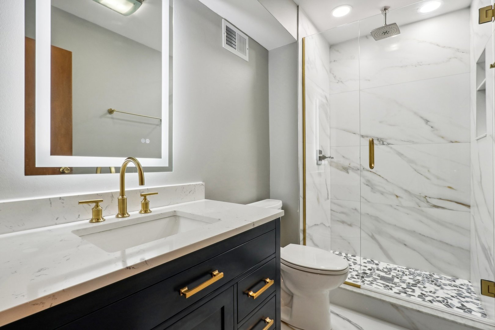 2405 Martin Lane Rolling Meadows, IL 60008 - Photo 18 of 22 a bathroom with a sink a toilet and shower