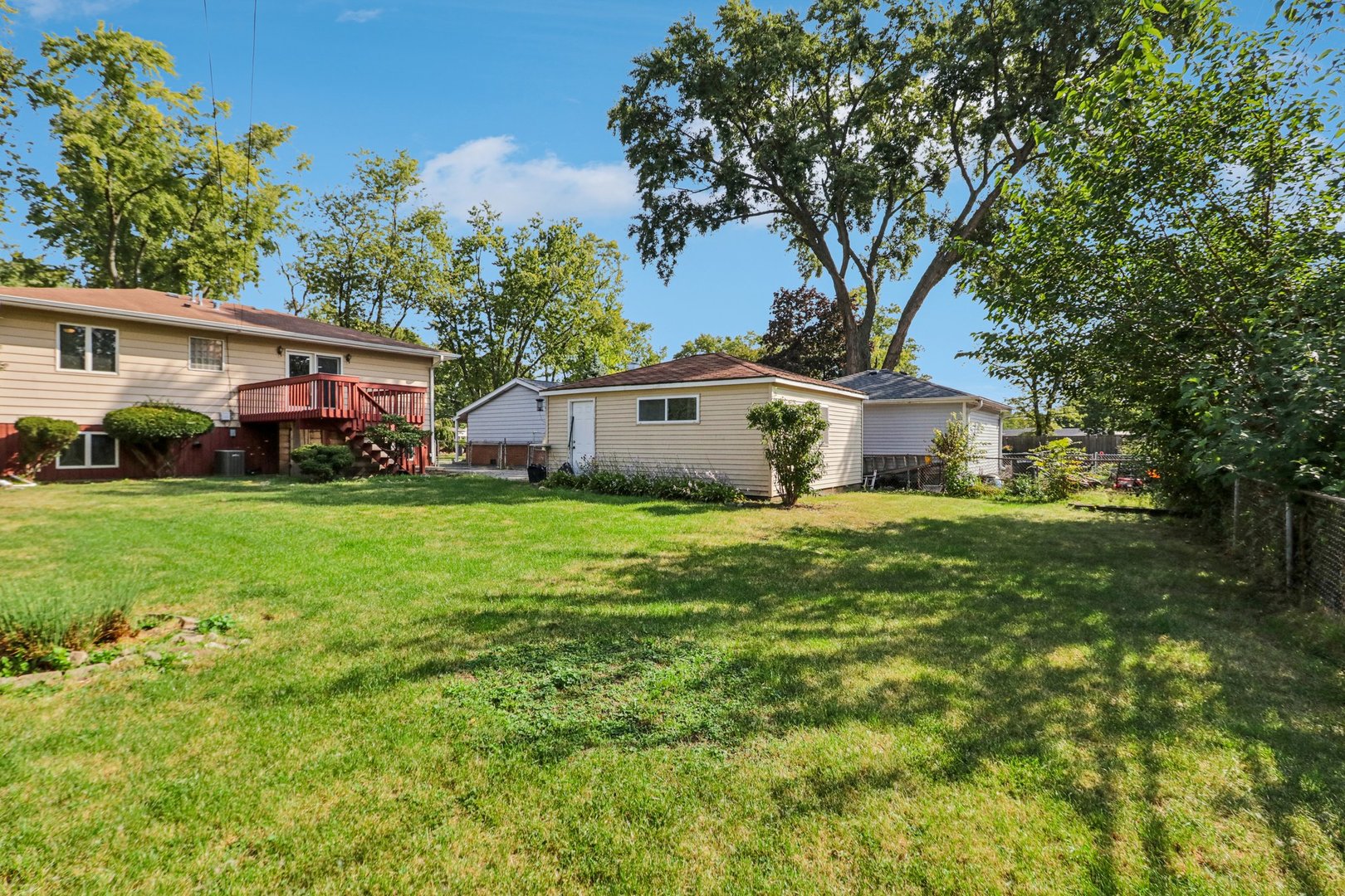 2405 Martin Lane Rolling Meadows, IL 60008 - Photo 21 of 22 a front view of house with garden and trees