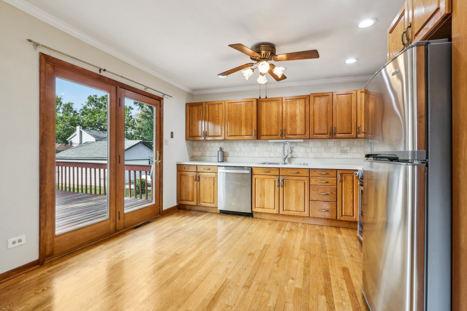 2405 Martin Lane Rolling Meadows, IL 60008 - Photo 7 of 22 a kitchen with granite countertop a stove a sink and a refrigerator
