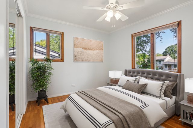 2405 Martin Lane Rolling Meadows, IL 60008 - Photo 9 of 22 a bedroom with a large bed and a window