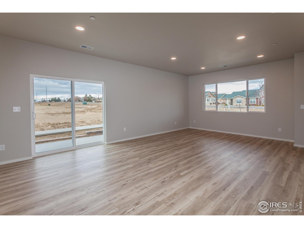 6929 4th St Road, Unit 1 Greeley, CO 80634 - Photo 10 of 38 EXAMPLE PHOTO: DINING ROOM AND LIVING ROOM
