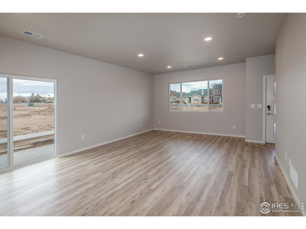 6929 4th St Road, Unit 1 Greeley, CO 80634 - Photo 11 of 38 EXAMPLE PHOTO: DINING ROOM AND LIVING ROOM