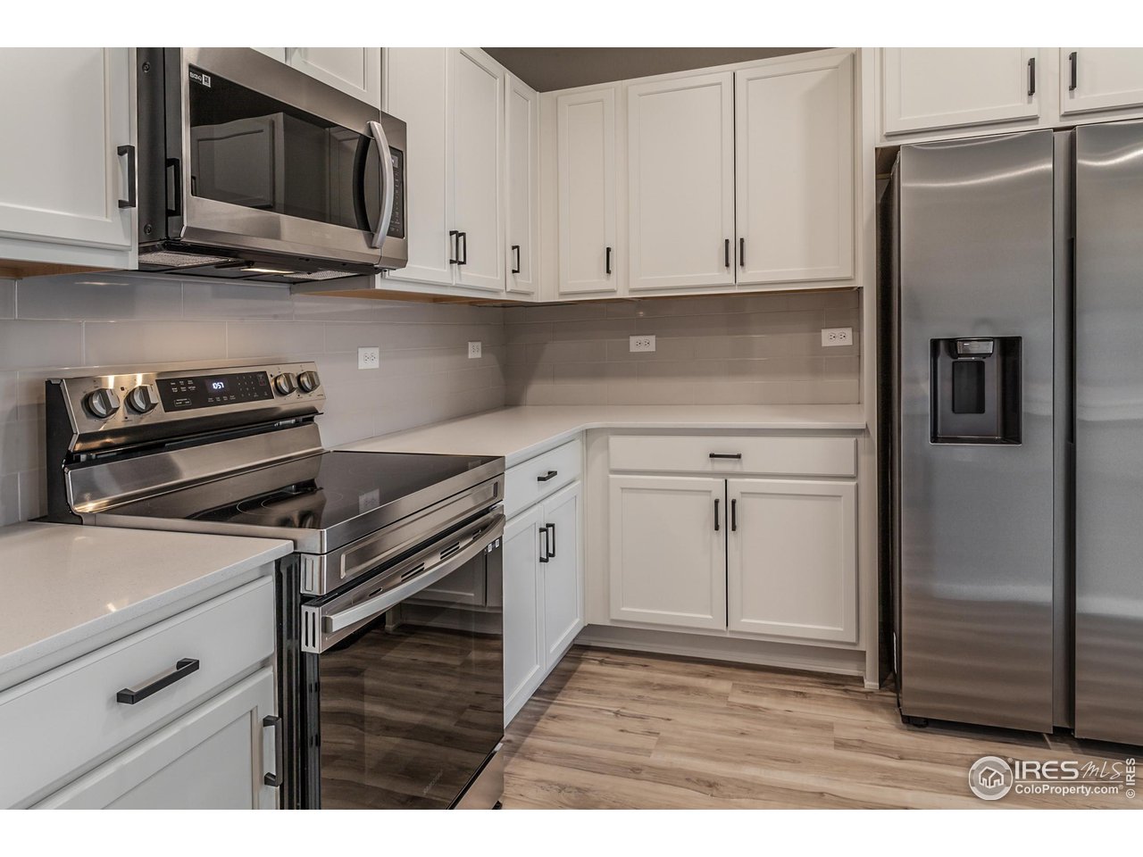 6929 4th St Road, Unit 1 Greeley, CO 80634 - Photo 12 of 38 EXAMPLE PHOTO: KITCHEN W. S.S. APPLIANCES