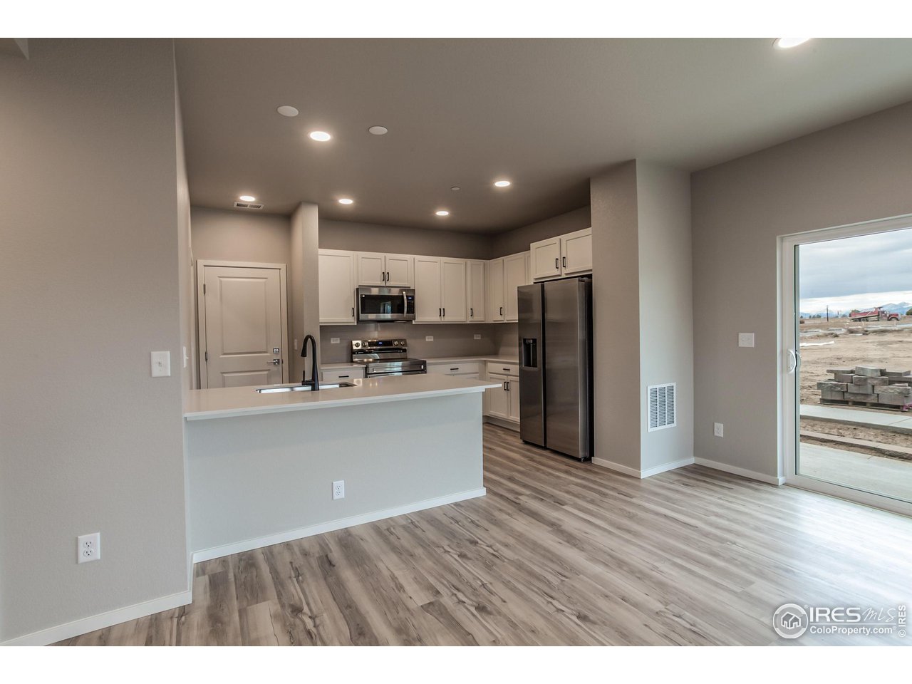 6929 4th St Road, Unit 1 Greeley, CO 80634 - Photo 9 of 38 EXAMPLE PHOTO: KITCHEN W/ S.S. APPLIANCES