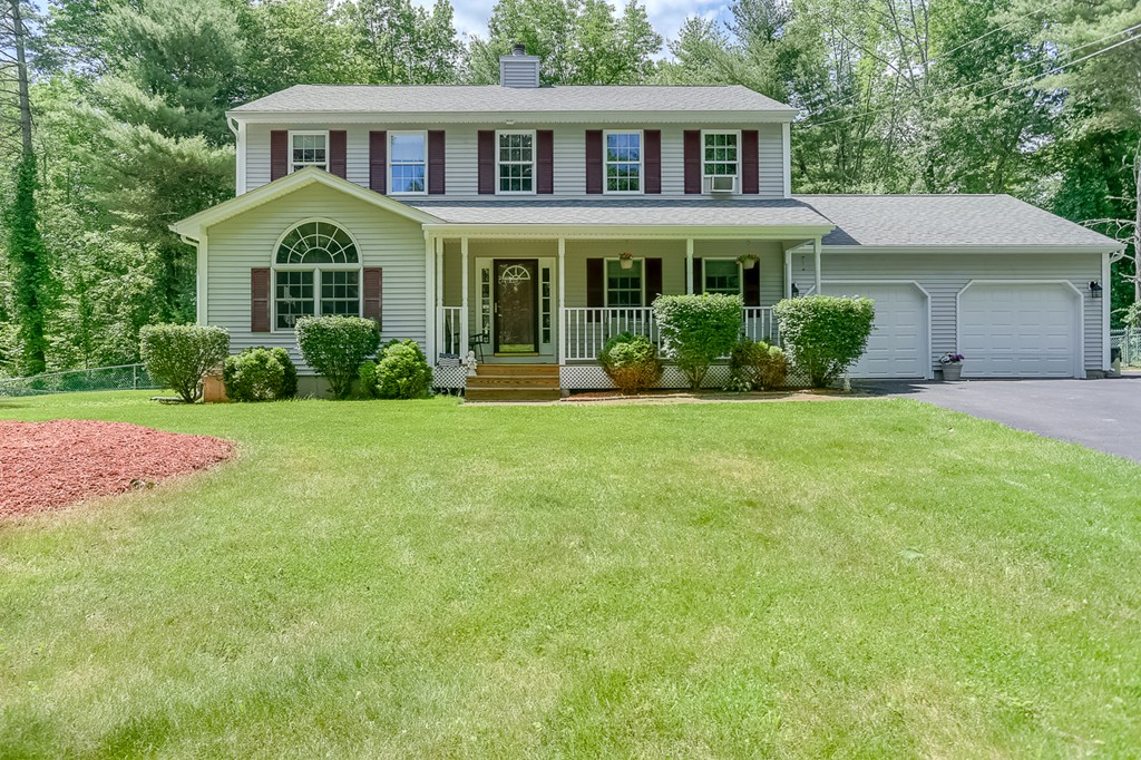 47 Babcock Tavern Road Ware, MA 01082 - Photo 1 of 27 a front view of a house with a yard and garage