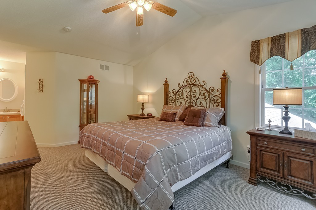 47 Babcock Tavern Road Ware, MA 01082 - Photo 13 of 27 a bedroom with a bed and a table in it