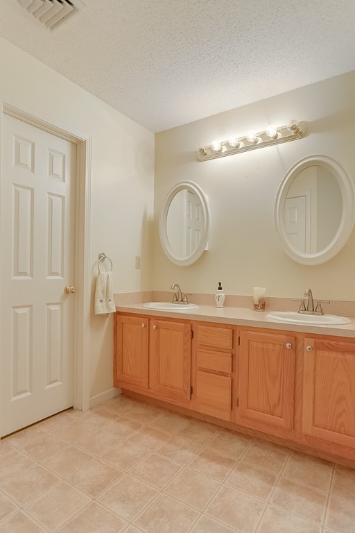 47 Babcock Tavern Road Ware, MA 01082 - Photo 14 of 27 a spacious bathroom with 2 sink and a mirror