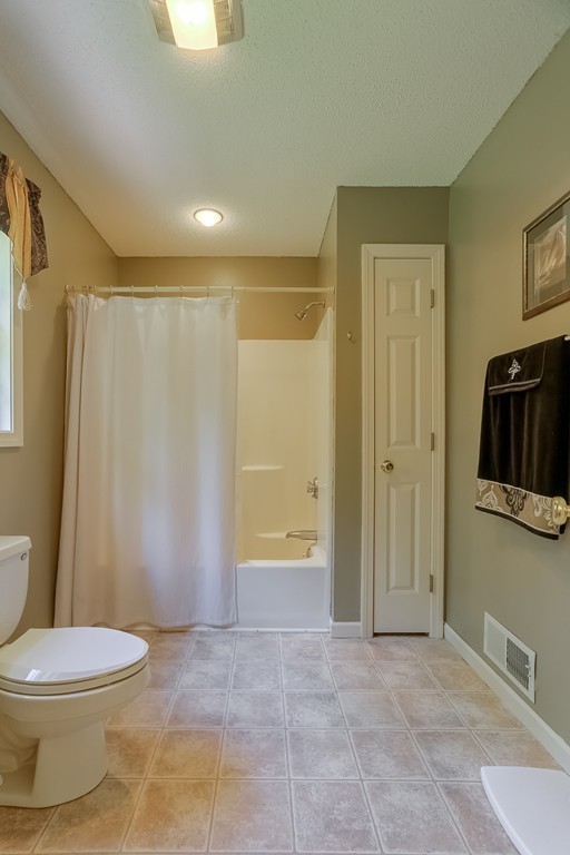 47 Babcock Tavern Road Ware, MA 01082 - Photo 15 of 27 a bathroom with a toilet and a shower