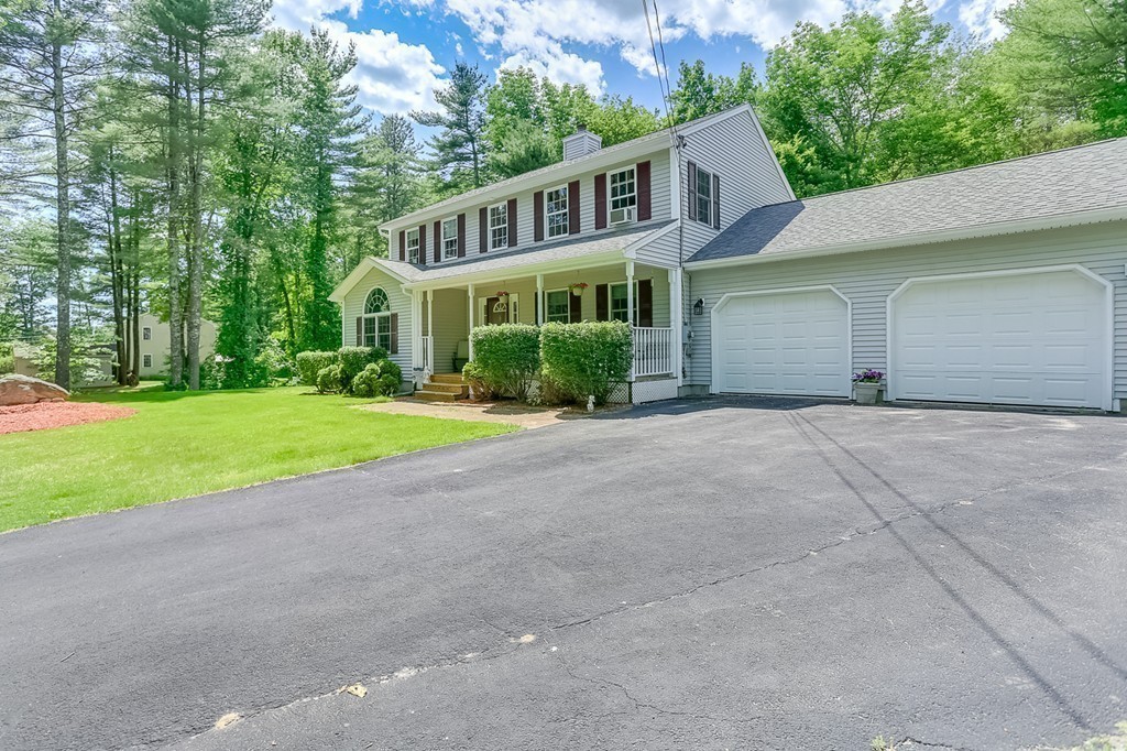 47 Babcock Tavern Road Ware, MA 01082 - Photo 24 of 27 a front view of a house with a yard and garage