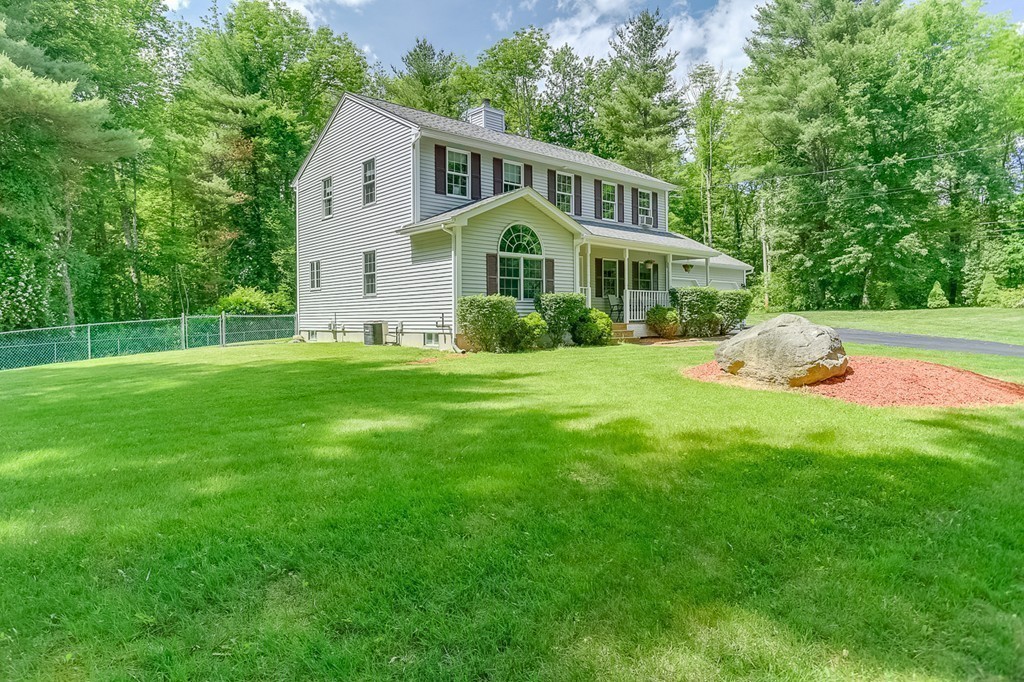 47 Babcock Tavern Road Ware, MA 01082 - Photo 25 of 27 a front view of house with yard and green space