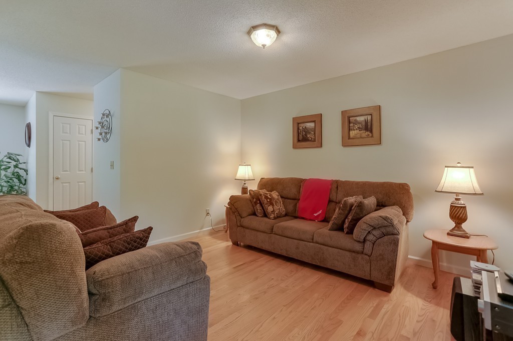 47 Babcock Tavern Road Ware, MA 01082 - Photo 9 of 27 a living room with furniture and a lamp