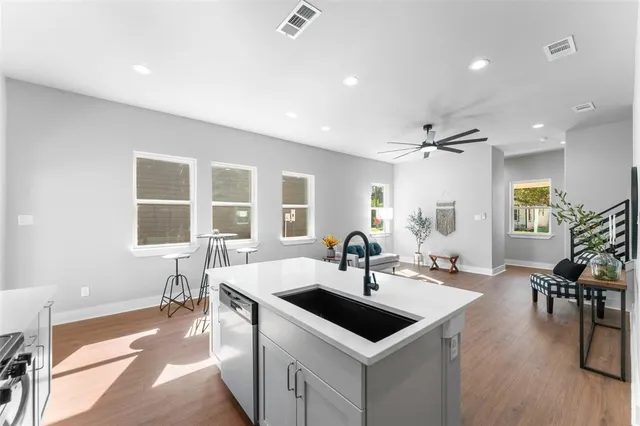 an aerial view of residential houses with outdoor space