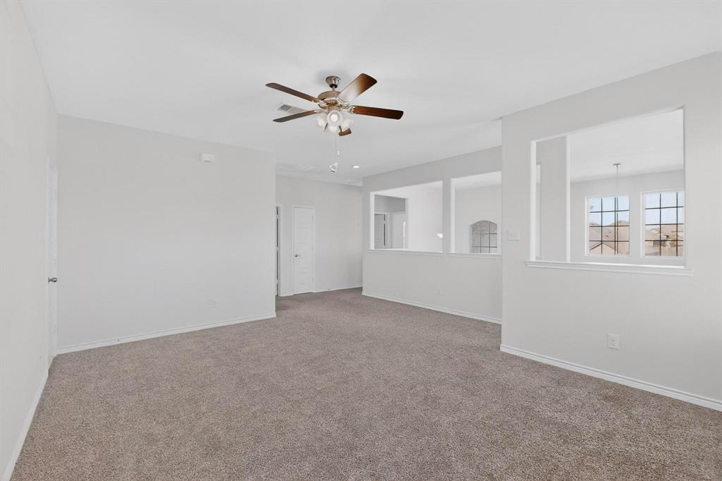 2917 Lampasas Lane Little Elm, TX 75068 - Photo 27 of 36 Spare room with light colored carpet and a ceiling fan