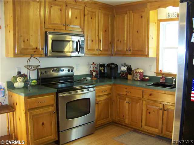 1500 West Rose Garden Road West Point, VA 23181 - Photo 3 of 12 Kitchen - Kitchen with Laminate Flooring and Stain