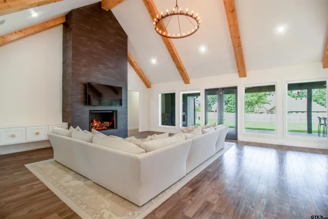 a living room with furniture and a fireplace