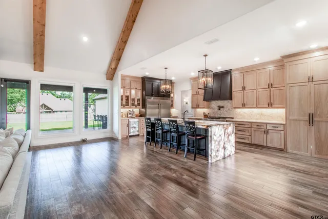 a kitchen with lots of counter top space and stainless steel appliances