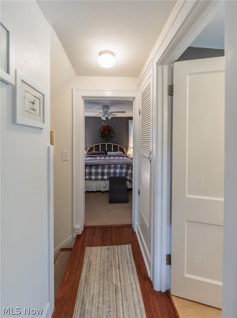 5364 Summit Road Lyndhurst, OH 44124 - Photo 20 of 42 Hallway with rich wood-finish flooring, white trim, and a flush-mount ceiling light