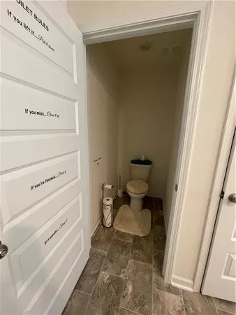 a swimming pool view with a seating space