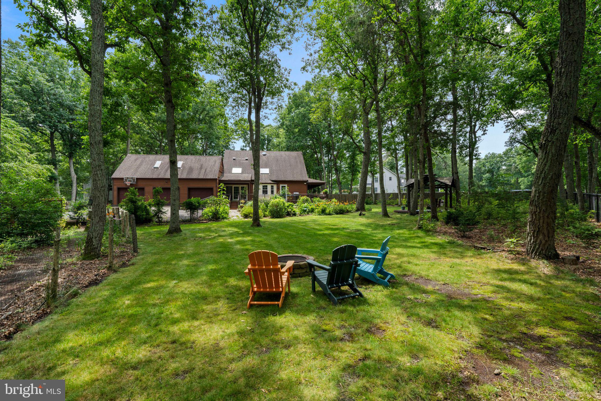 16 Dunhill Road Jackson, NJ 08527 - Photo 37 of 44 Serene woodland retreat with seating.