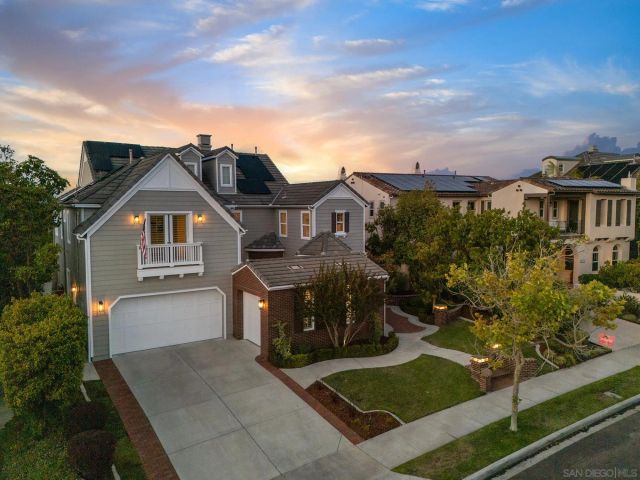 an aerial view of a house with swimming pool and outdoor seating